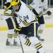 Michigan freshman Jon Merrill moves the puck down the ice during the second period against Lake Superior State at Yost Arena on Friday night. Melanie Maxwell I AnnArbor.com